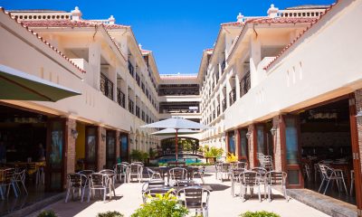 Outdoor restaurant tables on perfect white sand tropical beach